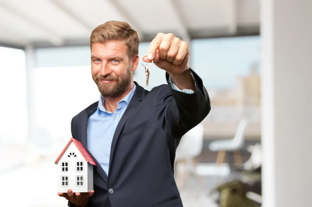 property investment consultants holding a house key